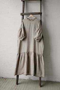 This oversized dress is made from 100% soft and washed linen. Details: - Composition: 100% Oeko-Tex certified linen - Colour: natural - Dropped shoulders - Linen belt - Ruffle skirt and neckline - Size: One size - fits all - Medium weight linen - Linen care: machine wash gentle; tumble dry low, ironing optional - The price is for one dress, other pictured items are not included Measurements: Length (from neck down) - 125 cm (49,2 in) Chest width - 140 cm (55,1 in) Sleeve length (from collar) - 6 Linen Daywear Dress With Ruffles, Linen Ruffle Dress For Daywear, Oversized Short Sleeve Dress For Brunch, Relaxed Fit Linen Ruffle Dress, Linen Ruffle Dress For Brunch, Relaxed Fit Linen Dress With Ruffles, Oversized Beige Lagenlook Dress, Beige Lagenlook Linen Dress, Oversized Neutral Summer Dress