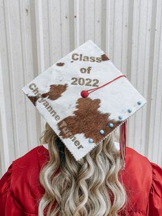 a woman wearing a graduation cap with the words class of 202 on it's side