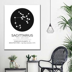 the zodiac sign sagittarius in black and white on a wall above a chair