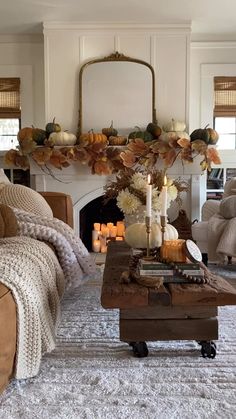 a living room filled with furniture and a fire place covered in candles next to a fireplace