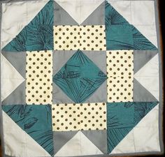 a quilted square with polka dots on it