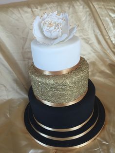 a white and gold wedding cake on top of a black stand with the words best 25 navy blue wedding cakes ideas on pinterest i do