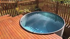 a hot tub sitting on top of a wooden deck