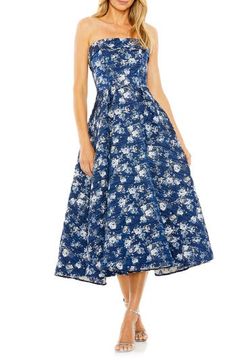 Serve up showstopping flair in this floral-brocade midi dress with a strapless silhouette and a flared skirt. 48 1/2" length Hidden back-zip closure Strapless Lined 100% polyester Spot clean Imported Asian Owned/Founded Spring A-line Strapless Gala Dress, Evening Midi Dress With Floral Print In Tea Length, Floral Print A-line Midi Dress For Gala, Spring Prom Midi Dress With Full Skirt, Floral Print Midi Dress For Gala, Evening Dress With Floral Print And Full Skirt, Evening A-line Midi Dress With Floral Print, Strapless Floral Print Midi Dress For Evening, Evening Midi Dress With Sweetheart Neckline And Floral Print