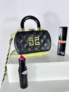 Beautiful Quilted PU Leather Lipstick Case Necklace/ Purse. Comes leather and gold chain. Great when your on the go for your Airpods, jewelry, or small lip gloss, keys, spare change/money holder etc. Purse comes Black PU leather with gold hardware. Removable chain.  Inside is mirrored on both sides for when you need a mirror to apply or check your lipstick! Measurements: 4 inches W, 3 inches H and 1.3 inches D.  Please reach out with any questions! See more items in this category: https://www.et Airpods Jewelry, Small Lips, Money Holder, Spare Change, Lipstick Case, Money Holders, Mini Purse, Purse Charms, Gold Hardware