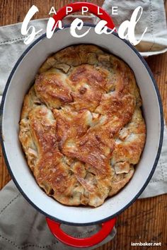 an overhead view of a pot pie in a pan on a wooden table with napkins