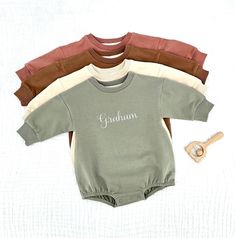 Embroidered Organic Cotton Baby Sweatshirt Romper, Long Sleeve Infant sweatshirt. HOW TO ORDER: In personalization box please include: 1. Name or word (only one word please) 2. Font number (check font chart) 3. Thread number (check thread color chart) Material: -95% Organic Cotton -5% Spandex    CARE: Hand or machine wash in cold or worm water. Tumble dry low heat or hang to dry. The embroidery can be ironed from the back on low-medium heat to remove any wrinkles. Sweatshirt Rompers are very soft and light weight, they are perfect for year-round.  Each Sweatshirt Romper is made to order, because is personalized it cannot be returned or replaced for a different size or color. Family Matching Long Sleeve Sweatshirt With Name Print, Customizable Long Sleeve Family Matching Sweatshirt, Personalized Name Print Long Sleeve Sweatshirt, Personalized Name Print Sweatshirt As Gift, Long Sleeve Sweatshirt With Name Print As Gift, Personalized Long Sleeve Sweatshirt As Gift, Customizable Long Sleeve Sweatshirt, Customizable Long Sleeve Cotton Onesie, Cute Long Sleeve Sweatshirt For Birthday