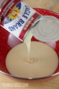 a can of soda being poured into a bowl