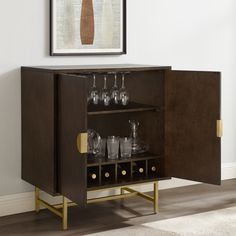 a wooden cabinet with wine glasses on it