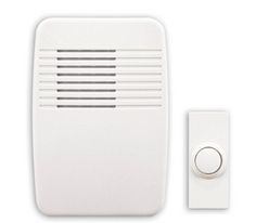 a white wall mounted fire alarm with thermostaer on it's side