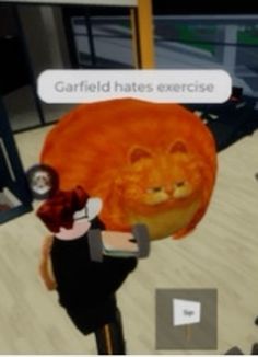 an animated image of a man holding a cat in front of a computer screen with the caption garfield hates exercise