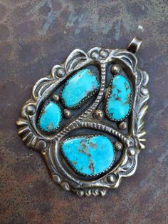 "This is a beautiful pendant made by Zuni master, Horace Iule. It displays an expert casting technique which is what he was well known for. This organic piece features 4 large, natural turquoise cabs set in handmade sawtooth bezels, and wonderful stamping through out. Ca 1950s Dimentions: 2 5/8\" × 2\" Weight: 36g" Turquoise Jewelry Native American, Native American Turquoise, American Turquoise, Southwestern Jewelry, Turquoise Pendant, Natural Turquoise, Multi Stone, Turquoise Jewelry, Online Jewelry