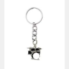 a metal keychain with a black and white photo on it's side