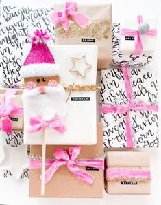 presents are wrapped in pink and white paper