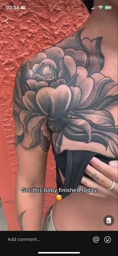 the back of a woman's body with flowers on it, and text that reads got this baby finished today