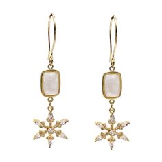 These beautiful earrings feature shimmering white moonstone, known for its ethereal glow and captivating play of light, paired with delicate snowflake accents. The dangle design adds movement and a touch of charm, making them perfect for any occasion.  Lightweight and comfortable, these earrings are ideal for both everyday wear and special events. Their unique combination of natural stones and intricate detailing makes them a standout piece that enhances your style. Natural moonstone, 14K gold plated brass. Take off your jewelry while working out, cleaning, gardening, showering, bathing or swimming in chlorinated or salt water. White Moonstone, Forever Jewelry, Charm Making, Jewelry Ring Box, Watch Necklace, Womens Jewelry Rings, Badger, Inspirational Gifts, Statement Jewelry