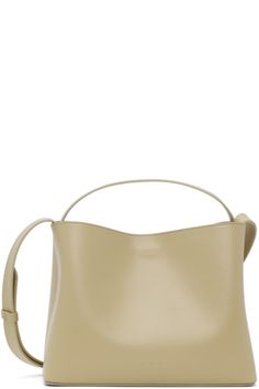 Aesther Ekme for Women FW22 Collection | SSENSE Cream Bucket Bag With Handle Drop, Modern Crossbody Box Bag For Errands, Modern Box Bag With Adjustable Strap For Errands, Bucket Shoulder Bag With Handle Drop For Errands, Chic Crossbody Bucket Bag With Top Carry Handle, Neutral Top Handle Shoulder Bag For Shopping, Neutral Double Handle Shoulder Bag For On-the-go, Chic Cream Bags With Handle Drop, Modern Shoulder Bag With Top Carry Handle For Errands