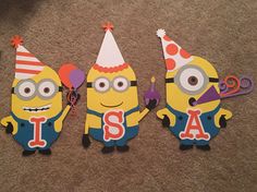 three paper cut outs with the words i, s and a minion on them