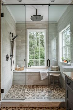 a bathroom with a walk in shower next to a window