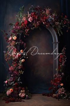 an arch decorated with flowers and vines is the focal point for this photo, which reads'beautiful '