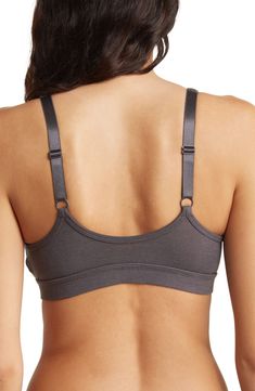 A stretchy bralette adds immense comfort to your laid-back style. . V-neck. Sleeveless. Adjustable straps. Unlined. Elasticized logo band. Imported Machine wash 66% viscose, 29% cotton, 5% elastane Calvin Klein Seamless Sports Bra With Medium Support, Calvin Klein Seamless Bra, Solid Color V-neck Sports Bra With Medium Support, Elegant Calvin Klein Bra With Built-in Support, Compressive Seamless V-neck Sports Bra, Laid Back Style, Bralette, Calvin Klein, Sports Bra