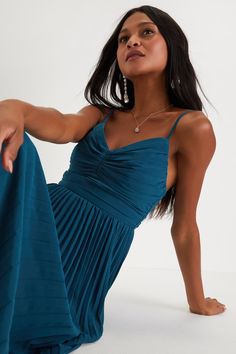 Whenever you wear the Lulus Sensational Charmer Teal Blue Pleated Sleeveless Maxi Dress, you'll just know you look fabulous! Lightweight pleated woven chiffon shapes this ultra-elegant dress that starts with a sleeveless bodice (with a flattering ruched detail at the center) and a V-neckline, supported by adjustable spaghetti straps. The fitted waist tops a breezy, A-line maxi skirt that continues down to a sweeping maxi hem. Hidden back zipper/clasp. Fit: This garment fits true to size. Length: Blue Summer Dresses With Folds, Blue Summer Dress With Folds, Sleeveless Blue Dress With Folds, Blue Sleeveless Dress With Folds, Chic Blue Dresses With Folds, Blue Pleated Party Dress, Blue Pleated Dress For Cocktail, Elegant Sleeveless Blue Pleated Dress, Chic Blue Pleated Party Dress