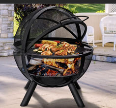 an outdoor bbq grill with lots of food on it