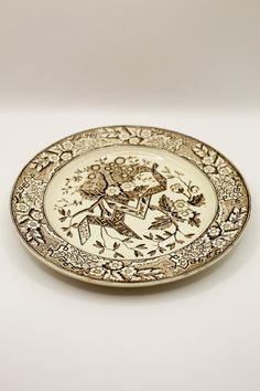 an ornately decorated plate on a white surface