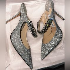 Excellent Condition! Worn Once Indoors. Size 38 Is 7-7.5 Original Box Included No Cancellations! If You Put An Offer, And I Accept It, I Will Not Cancel The Order Afterwards. Ask All The Questions Beforehand. Luxury Glitter Heels For Wedding, Luxury Sparkling Heels For Wedding, Luxury Sparkling Wedding Heels, Luxury Silver Glitter Heels, Luxury Glitter Heels With Round Toe, Luxury Heels With Bling And Round Toe, Luxury Bling Heels With Round Toe, Luxury Heels With Bling, Luxury Silver Heels With Bling