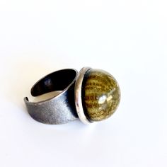 Marine inspiration, this ring is made with a real sea urchin and deep blue resin in a brass base ring, antique silver finish.  Unique model!  My work features brilliant colors and resin. Resin results in a durable piece that has a natural shine and is resistant to scratches.  I handmade each piece in my studio in Barcelona and no two are alike. This jewelry is handmade and slight differences are part of the character of the piece.  I will send the order packed in a nice craft box, ready to gift! Nickel-free Round Earthy Jewelry, Nickel-free Earthy Round Jewelry, Modern Handmade Round Rings, Modern Handmade Round Ring, Nickel-free Nature-inspired Round Rings, Nature-inspired Nickel Free Round Rings, Nature-inspired Nickel-free Rings, Handmade Earthy Style Rings As Gifts, Earthy Handmade Rings For Gifts