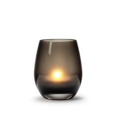 a black glass with a light inside it