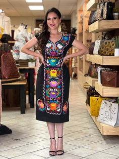 -This Beautiful Long Mexican Colorful Floral Dress is the perfect dress for a fun night out or a special event. -It is full of colorful embroidered flowers and has some crocheted details. -This dress has ties on the back in order to adjust the fit. - You can purchase the dress either with or without the belt. Available size: S - 2X. Please note: The accesories shown with this dress may purchased as well and Can be found in this links Earrings:https://www.etsy.com/es/listing/855938626/aretes-mexi Short Sleeve Embroidered Dress For Party, Multicolor Embroidered Short Sleeve Dress For Party, Short Sleeve Embroidered Dress With Multicolor Embroidery For Party, Party Dress With Multicolor Embroidery And Short Sleeves, Multicolor Embroidery Short Sleeve Party Dresses, Fitted Party Dress For Day Of The Dead, Embroidered Short Sleeve Fiesta Dress, Fiesta Embroidered Short Sleeve Dresses, Fitted V-neck Dress With Multicolor Embroidery