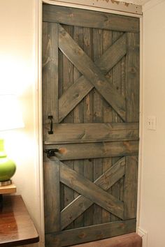 a wooden door in the corner of a room