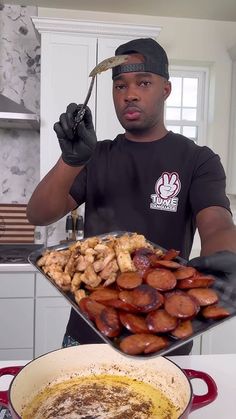 a man holding a large platter of food in his hands