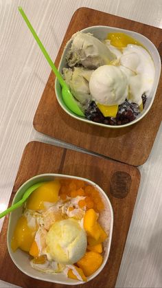 two bowls filled with fruit and ice cream