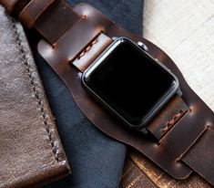 "Handcrafted leather bund strap for Apple Watch Series SE, 6, 5, 4, 3 & 2 - WW2 Military Pilot Bund Strap - Antique Brown FEATURES -Compatible with Apple Watch Series SE, 6, 5, 4, 3 & 2 -Interchangeable Apple Watch spring bar adapter -Single layered leather construction -Standard Length: 80mm/125mm - 3.1\"/ 4.9\" -Thickness: 1.6-1.8mm -Stainless steel buckle included. -Durable waxed thread -Handmade and hand stitched *Measure the buckle and lug width (the width between the area where you Business Leather Apple Watch Band, Leather Apple Watch Band For Everyday Use, Leather Apple Watch Band Perfect As A Gift, Leather Bracelet Strap Apple Watch Band As Gift, Ww2 Pilot, Apple Watch Leather, Wooden Watches For Men, Apple Watch Sizes, Watch Engraving