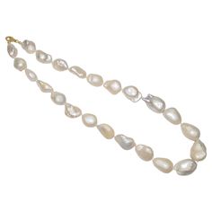 Details: : 14k Yellow Gold Lock Freshwater baroque pearl beads : Item no- KM82/300 :Pearl Size: 16mmx23mm (Approx.) :Necklace length: 20" Inches If you need other special size, please tell me. :Pearl Shape: baroque : Color: white : Pearl skin: clean, with very little flaws : Grade(my shop): AAA : Pearl luster: good : Shape: please look at picture : Clasps - 14 k Pure Gold :All measurements approximate Pink Topaz Necklace, Grey Pearl Necklace, Pink Pearl Necklace, Pearl Necklace Wedding, White Pearl Necklace, Topaz Necklace, Party Necklace, Pink Topaz, Modern Necklaces