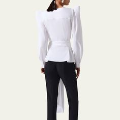 Carolina Herrera wrap top with self-belt V neckline Long puff sleeves Fitted Cotton/polyurethane Dry clean Made in USA Elegant Belted Blouse For Work, Elegant Wrap Top For Workwear, Elegant Wrap Top For Work, Elegant Long Sleeve Belted Top, Chic Fitted Belted Blouse, Elegant Fitted Wrap Top For Work, Chic Fitted Wrap Top For Work, Long Puff Sleeves, V Neckline