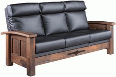 a black leather couch sitting on top of a wooden frame