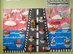 a bulletin board with cars, boats and hot air balloons attached to the side of it