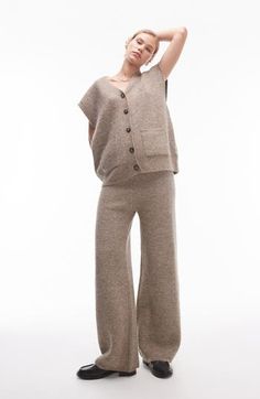 Get extra cozy for the cooler seasons in these wool-kissed sweater-knit pants cast in a calming, earthy hue. 33" inseam; 23" leg opening; 12" front rise; 14" back rise (size Medium) Elastic waist 64% polyester, 14% acrylic, 14% nylon, 5% wool, 3% elastane Hand wash, dry flat Imported Casual Wool Pants For Loungewear, Cozy Brown Bottoms For Fall, Casual Beige Wool Bottoms, Casual Full Length Wool Pants, Cozy Cashmere Bottoms For Winter, Casual Wool Bottoms With Relaxed Fit, Relaxed Fit Wool Pants For Fall, Cozy Cashmere Bottoms For Fall, Beige Soft Knit Bottoms For Fall