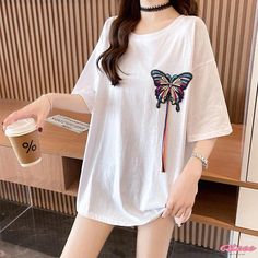 Qteee - Elegantly Embroidered Round Collar T-Shirt with Butterfly Design White Embroidered Crew Neck Top, White Crew Neck Top With Embroidered Graphics, White Embroidered T-shirt For Summer, White Floral Embroidered T-shirt, White Floral Embroidered Short Sleeve T-shirt, White Floral Embroidery Short Sleeve T-shirt, White Short Sleeve T-shirt With Floral Embroidery, Casual Crew Neck Top With Embroidered Graphics, White Embroidered Casual Shirt