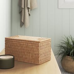 a wicker basket sitting on top of a wooden table