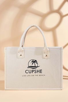 Need the perfect beach accessory? The Cupshe Branded Tote Bag is just what you need. Featuring the Cupshe name, logo, and motto "Live life on the beach," this tote is both stylish and practical! Product code: CAC12C4E003GG Features:  Material: 100%POLYURETHANE. Trendy Canvas Bag For Beach Season, Trendy Canvas Shoulder Bag For Beach Season, Double Handle Canvas Bag For Beach Season, Canvas Double Handle Bag For Beach Season, Canvas Double Handle Bag For Daily Beach Use, Summer Beach Bag With Letter Print, Vacation Tote Shoulder Bag With Letter Print, Casual Beach Shoulder Bag With Letter Print, Rectangular Letter Print Beach Bag