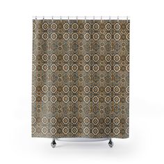 a brown and blue shower curtain with an abstract design on the bottom, in front of a white background