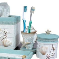 bathroom accessories including toothbrushes, soap dispenser and tissue box