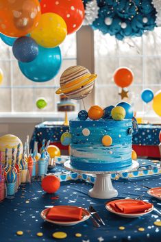 a space themed birthday party with balloons and cake