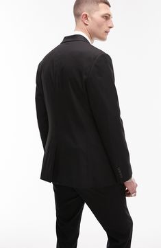 Narrow notched lapels streamline a clean, single-breasted suit jacket tailored in a modern, skinny fit with subtle texture. 30" length (size 42 R) Two-button closure Chest besom pocket; front flap-welt pockets; interior welt pocket Lined 64% polyester, 34% viscose, 2% elastane Dry clean Imported Sleek Formal Outerwear With Double Button Closure, Sleek Notched Suit For Office Wear, Sleek Notched Suits For Office Wear, Sleek Notched Suits For Office, Slim Fit Single Breasted Blazer For Business Casual, Single Breasted Slim Fit Blazer For Business Casual, Business Casual Slim Fit Single Breasted Blazer, Solid Single Breasted Slim Fit Blazer, Sleek Single-button Suits For Office