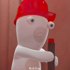 a white bear with a red hard hat holding a brown stick and wearing a red cap