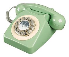 an old - fashioned green phone is shown on a white background